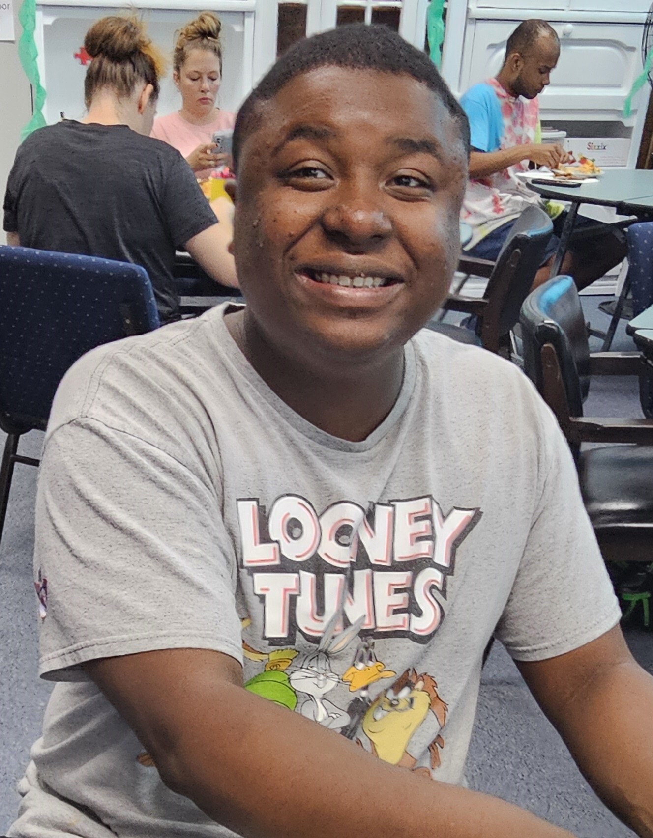 Man smiling in dining hall